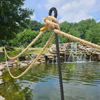 Heavy-duty rebar loop stake securing a rope barrier to prevent accidental falls into the lake, providing safety for ponds and garden water features
