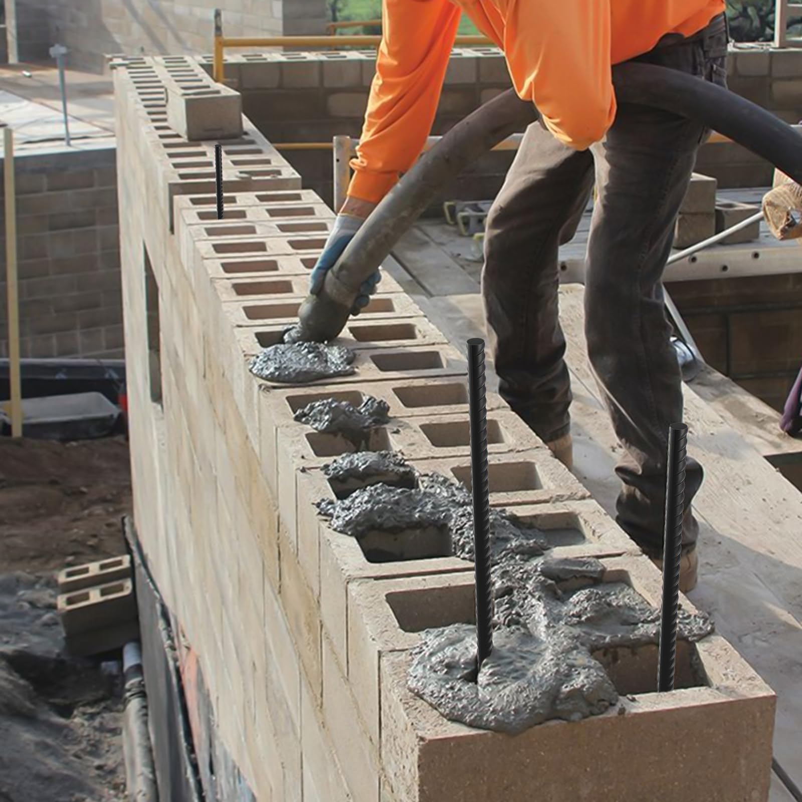 Bracing and securing wooden concrete forms for a foundation pour using 40-inch rebar stakes