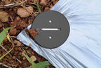Close-up of round plastic gasket on hot-dip galvanized landscape staple, preventing tears and increasing ground contact